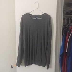 A dark, charcoal grey sweater